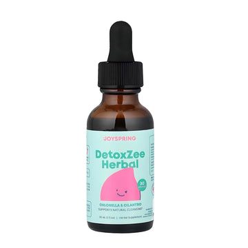 Brown glass bottle with dropper labeled 'DetoxZee Herbal' by Joyspring on a white background